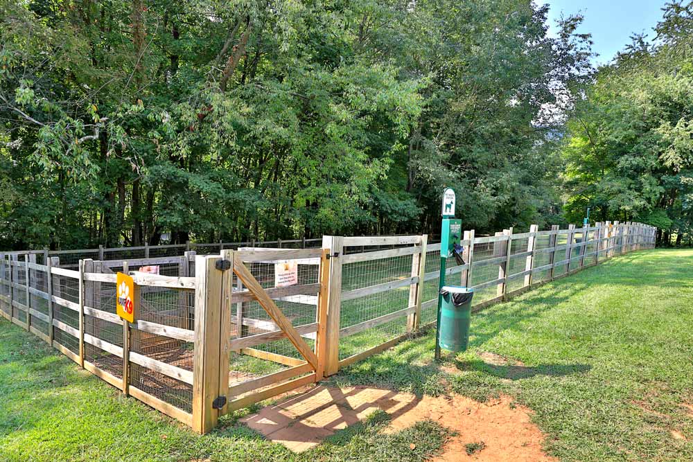 Our dog run is a large, fenced play area for your fur babies, at Asheville West KOA.